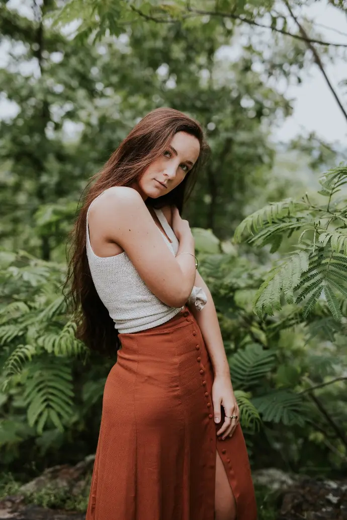 woman posing near leaf